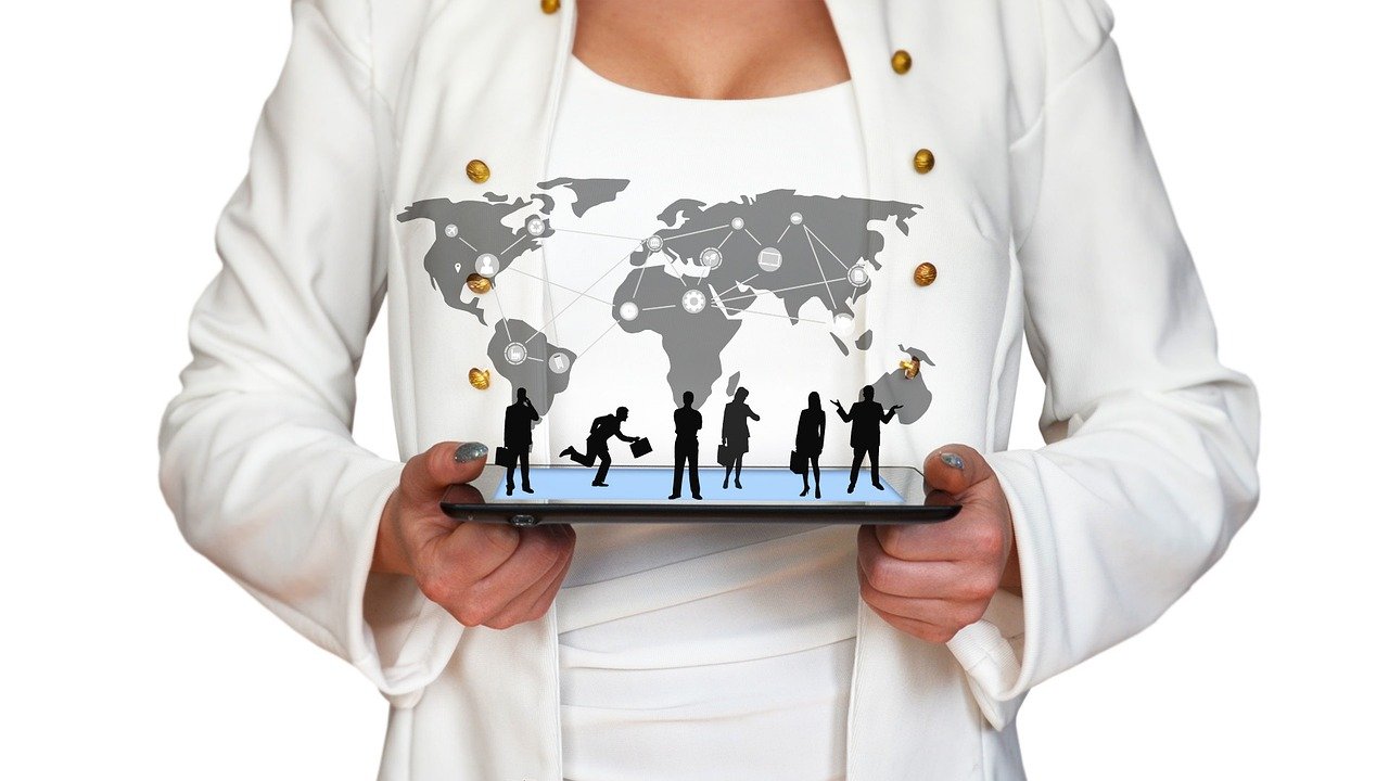 A woman in a white jacket holding a smartphone