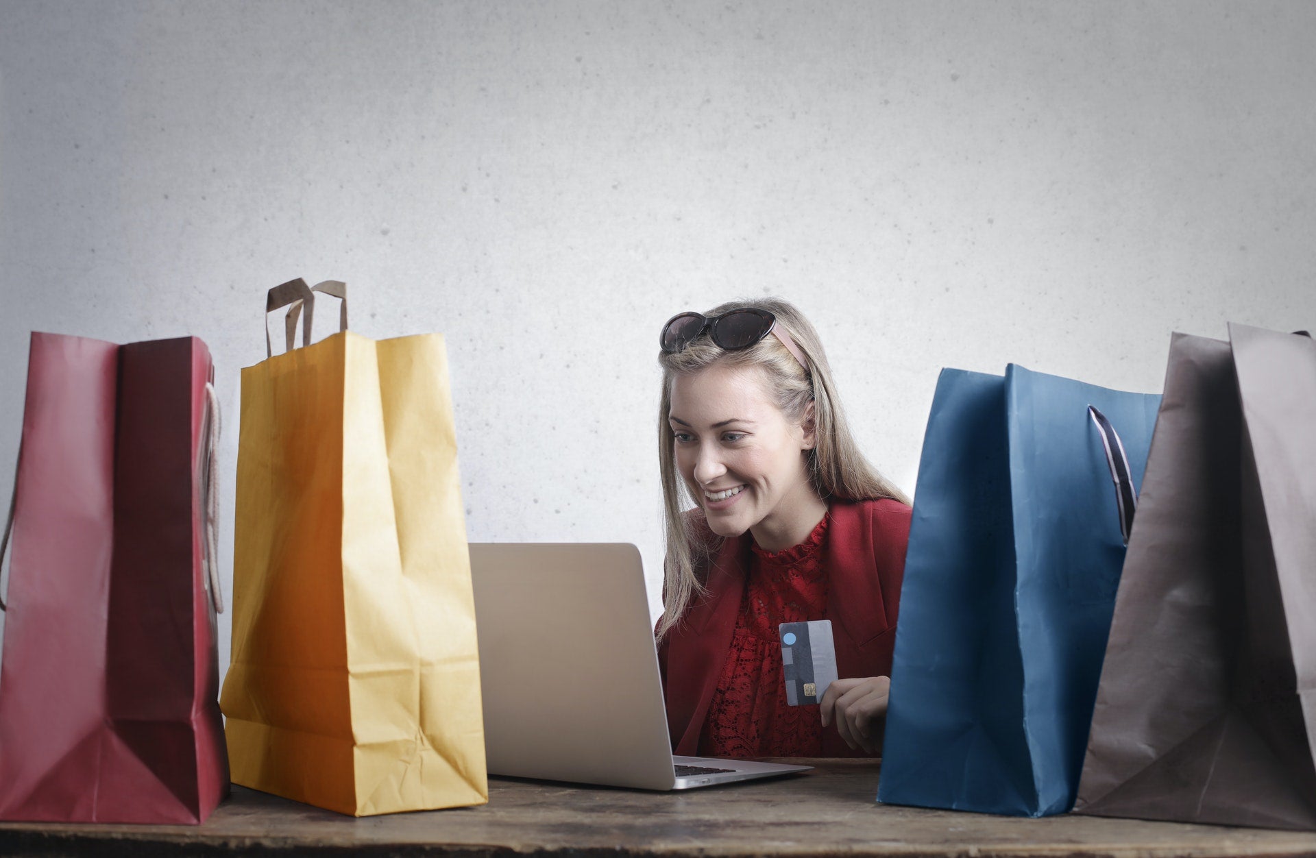 A happy woman doing online shopping 